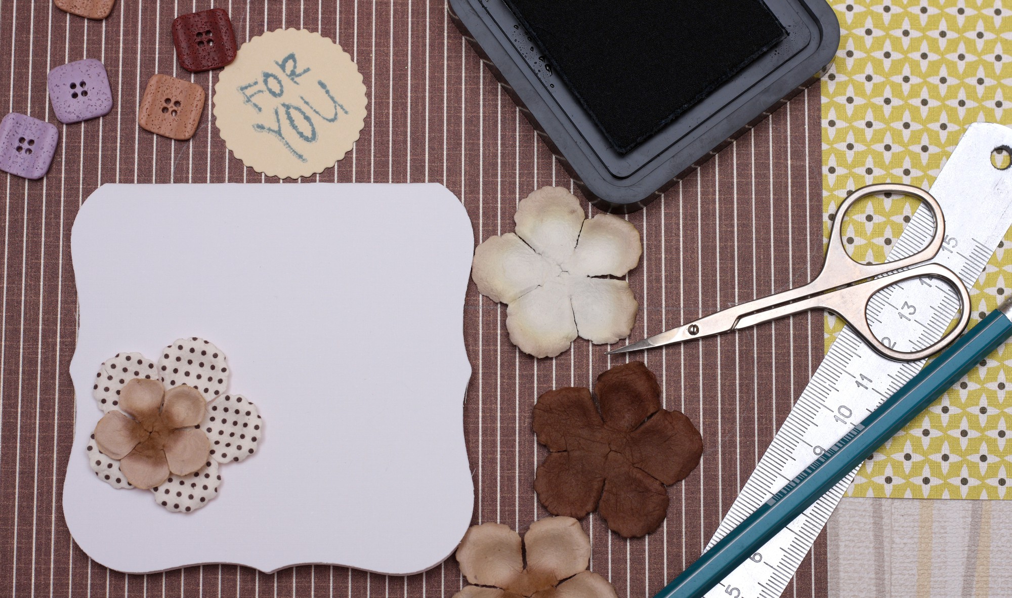Sample embroidered patches laid out on table