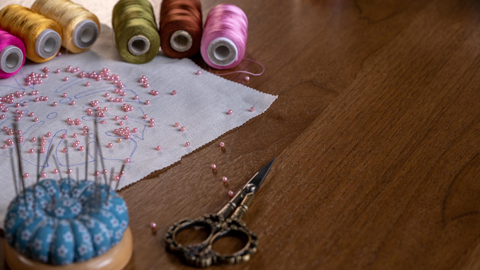 Studio workspace with threads and patterns
